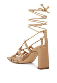 STRINGS ATTACHED BRAIDED BLOCK HEELED SANDAL